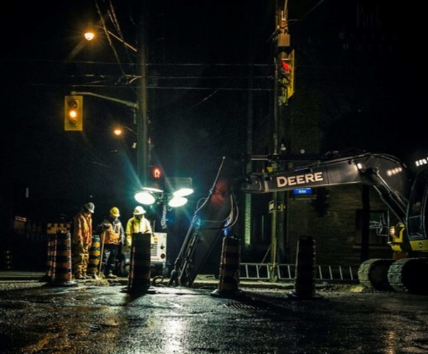 Image of engineers repairing a leak at night