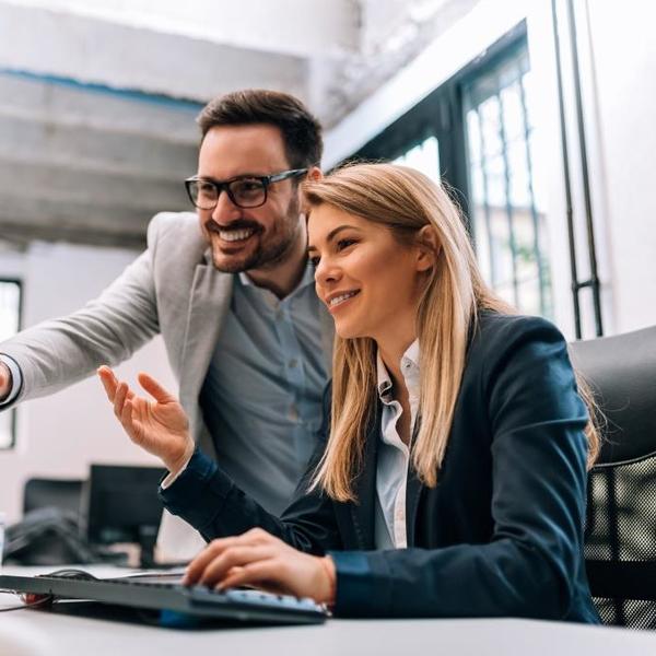 Employees collaborating in office