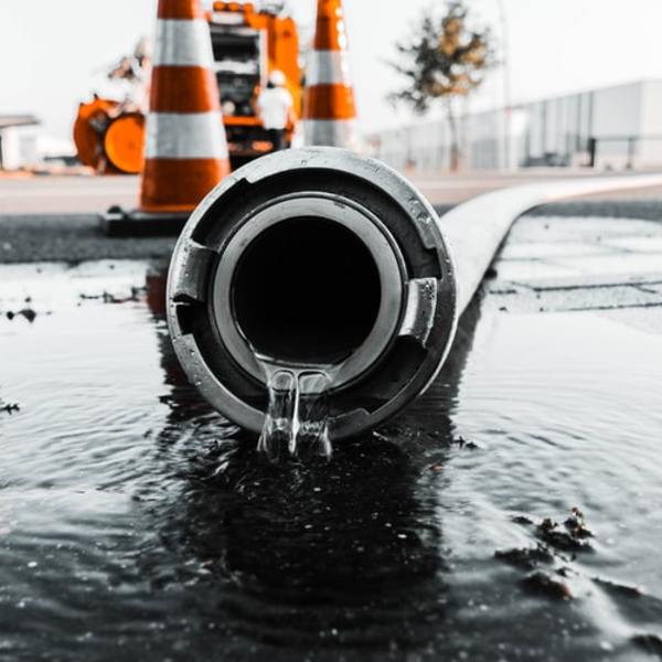 Water pipe leaking on to road